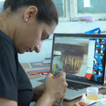 Zuby Johal painting the prosthetic teeth for a character in Ghost Stories